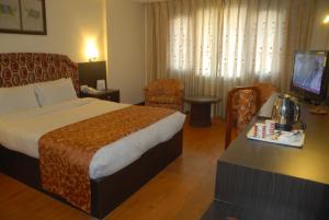 Voodi või voodid majutusasutuse Hotel Vaishali toas
