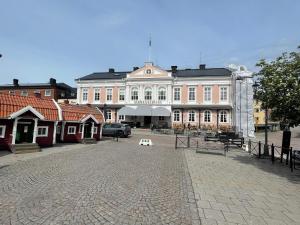 a large white building with a white bench in front of it at 4 person holiday home in Södra vi-By Traum in Södra Vi