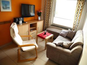 TV a/nebo společenská místnost v ubytování Island house Paul on the island of Poel