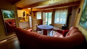 a living room with a couch and a table at Holiday Home Stella Star in Žabljak
