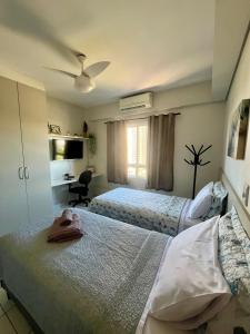 En eller flere senge i et værelse på Studio Iguatemi Ribeirão Preto + 53 billeder