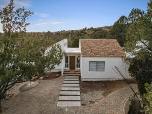 a white house with a pathway leading to it at Perfect home in Sedona With HotTub in Sedona