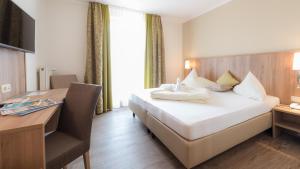 Ένα ή περισσότερα κρεβάτια σε δωμάτιο στο Hotel Marko