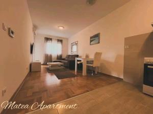 a living room with a couch and a table at Matea in Budva