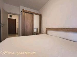 a bedroom with a large white bed in a room at Matea in Budva