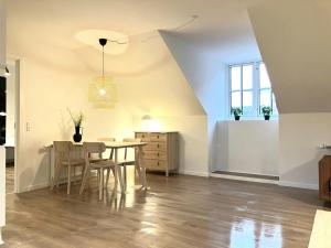 a dining room with a table and chairs at Spacious Apartment for 4 in Esbjerg