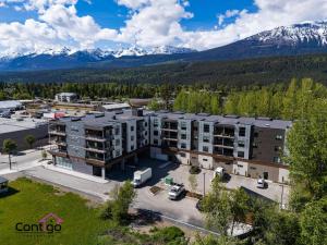 an aerial view of an apartment complex with mountains in the background at Rivers Edge, Mtn Views, AC, BBQ, King Bed in Golden