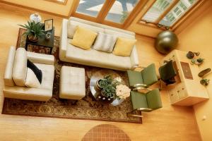 an overhead view of a living room with a couch and chairs at SunnyPeace Modern Home Stay in Harwinton
