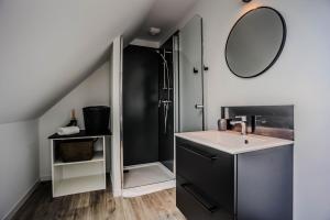 a bathroom with a sink and a mirror at la maison du bord de mer in Penvénan +39 photos
