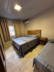 Postel nebo postele na pokoji v ubytování Casa com 2 quartos - quintal e área de lazer