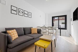 a living room with a couch and a table at Urban Oasis in Fuengirola
