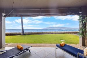 a view of the ocean from the porch of a house at Direct Oceanfront Beach Pohailani Studio - New in Kahana