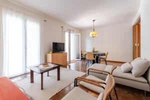 a living room with a couch and a table at Holiday Home Mareta in Dubrovnik