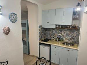 Kuchyň nebo kuchyňský kout v ubytování La Piccola Ginevra + 7 fotografií