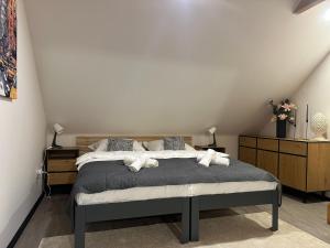 Postel nebo postele na pokoji v ubytování Apartments 23