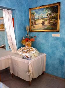 a table with a plate of food on top of it at Pensione Villa Ida in Termoli