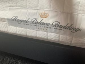 a mattress with the royal palace bedding on it at Les lauriers du loft in Pazayac +22 photos