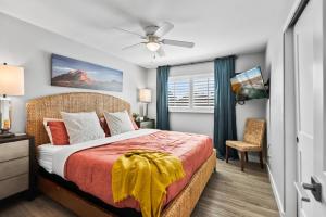 a bedroom with a bed and a ceiling fan at Scottsdale Getaway with Hot Tub Games and Office in Scottsdale