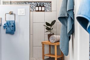 a small table with a plant on it next to a door at Scottsdale Getaway with Hot Tub Games and Office in Scottsdale +57 photos