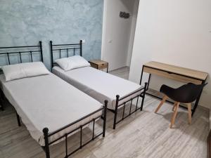 Postel nebo postele na pokoji v ubytování Agorà di Favignana - Affittacamere Piazza Madrice