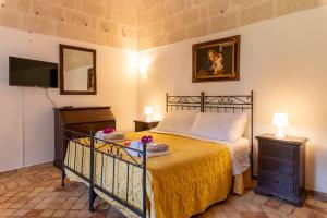 Postel nebo postele na pokoji v ubytování Agriturismo La Stornara