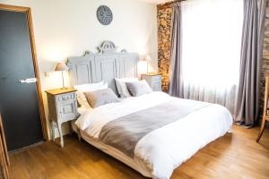 Postel nebo postele na pokoji v ubytování B&B Le Tapis Rouge