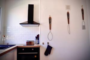 Kuchyň nebo kuchyňský kout v ubytování Chaleureux appartement avec parking gratuit + 11 fotografií