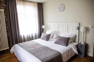 Postel nebo postele na pokoji v ubytování B&B Le Tapis Rouge