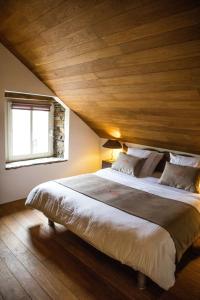 Katil atau katil-katil dalam bilik di B&B Le Tapis Rouge