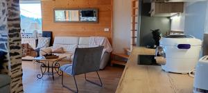 a living room with a couch and a table at Chalet-nature in Bolquere Pyrenees 2000