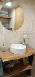 a bathroom with a white sink and a mirror at Chalet-nature in Bolquere Pyrenees 2000 +16 photos