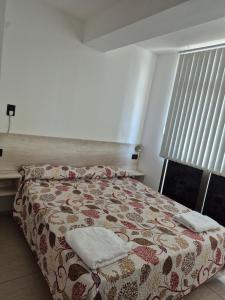 Ένα ή περισσότερα κρεβάτια σε δωμάτιο στο pedro de valdivia 219 oeste