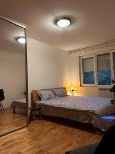 Postel nebo postele na pokoji v ubytování Feniks Apartment