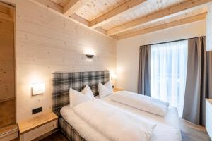 Ένα ή περισσότερα κρεβάτια σε δωμάτιο στο Residence Bosco Verde