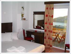 Postel nebo postele na pokoji v ubytování Rita's Place Hotel