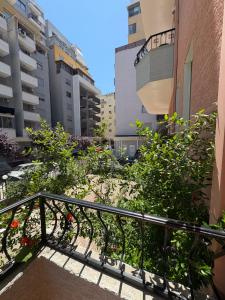 a staircase in a city with buildings and plants at Villa Klinton in Durrës
