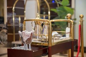 a gold stand with a trophy on a table at توارن للشقق المخدومة الاقتصادية in Riyadh