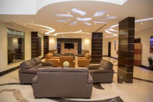 a large living room with couches and a fireplace at توارن للشقق المخدومة الاقتصادية in Riyadh