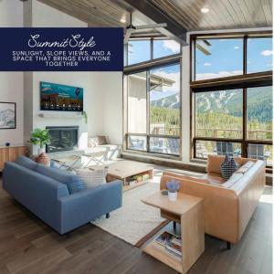 a living room with a couch and a table at The Pinnacle in Winter Park
