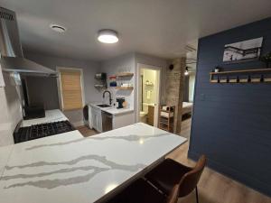 a kitchen with a sink and a counter top at Stylish Modern Studio in Vibrant Walker's Point in Milwaukee +7 photos