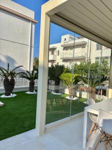 a view of a patio from a house with sliding glass doors at Settanni Suites in Polignano a Mare