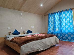 Ένα ή περισσότερα κρεβάτια σε δωμάτιο στο Discover Himalaya Camps