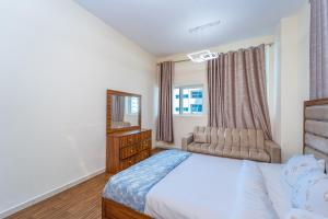 Voodi või voodid majutusasutuse Luxury 2 bedroom next to beach with swimming pool gym and kids play area toas +13 fotot