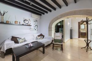 Ένα ή περισσότερα κρεβάτια σε δωμάτιο στο Casa típica mallorquina en Sa Pobla