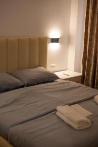 Ένα ή περισσότερα κρεβάτια σε δωμάτιο στο Tirana Dream Apartments