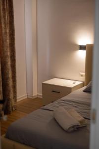 Ένα ή περισσότερα κρεβάτια σε δωμάτιο στο Tirana Dream Apartments