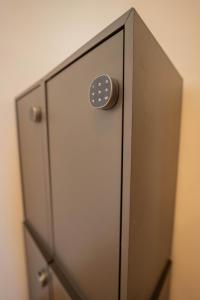 a door with a button on top of it at Drunken Monkey Hostel in Prague
