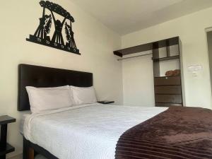 Postel nebo postele na pokoji v ubytování Alojamiento en Morelia