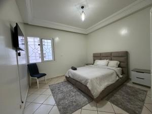 Postel nebo postele na pokoji v ubytování Aprt au centre ville Agadir