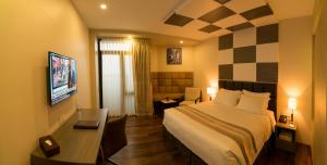 A bed or beds in a room at Hotel Parami